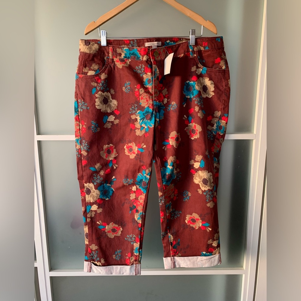 Maroon jeans with flower pattern. New. Size 18 W. Cropped and cuffed.